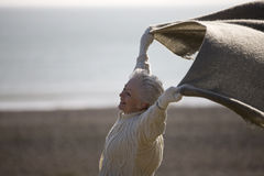 senior-woman-standing-blanket